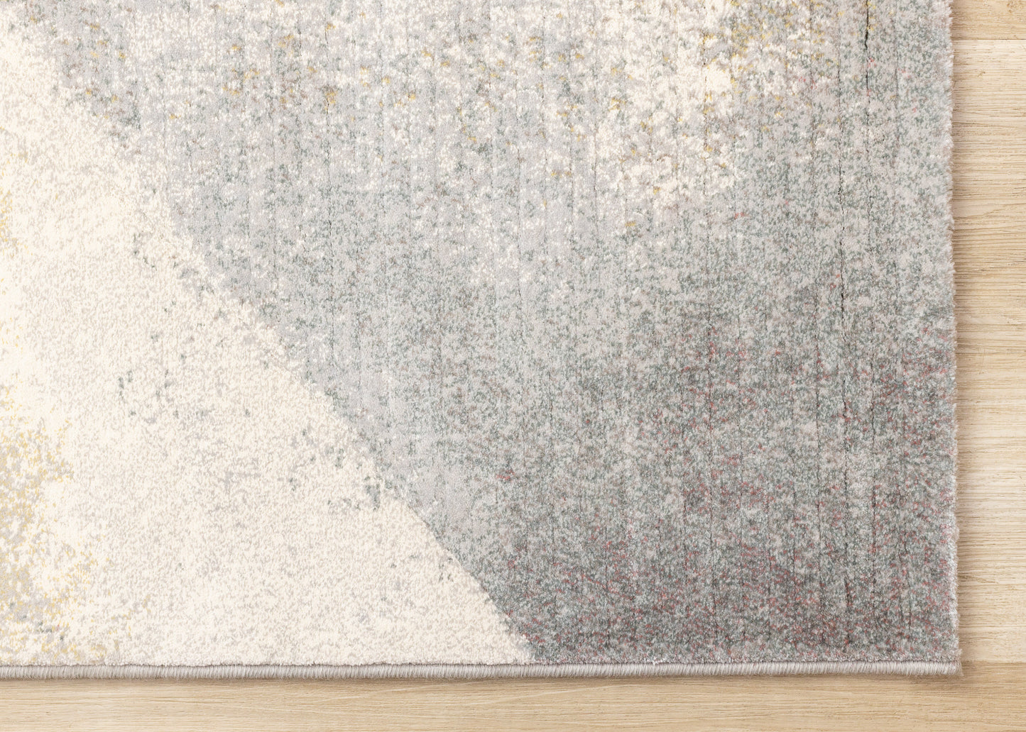 Alfombra contemporánea gris con diseño geométrico desgastado