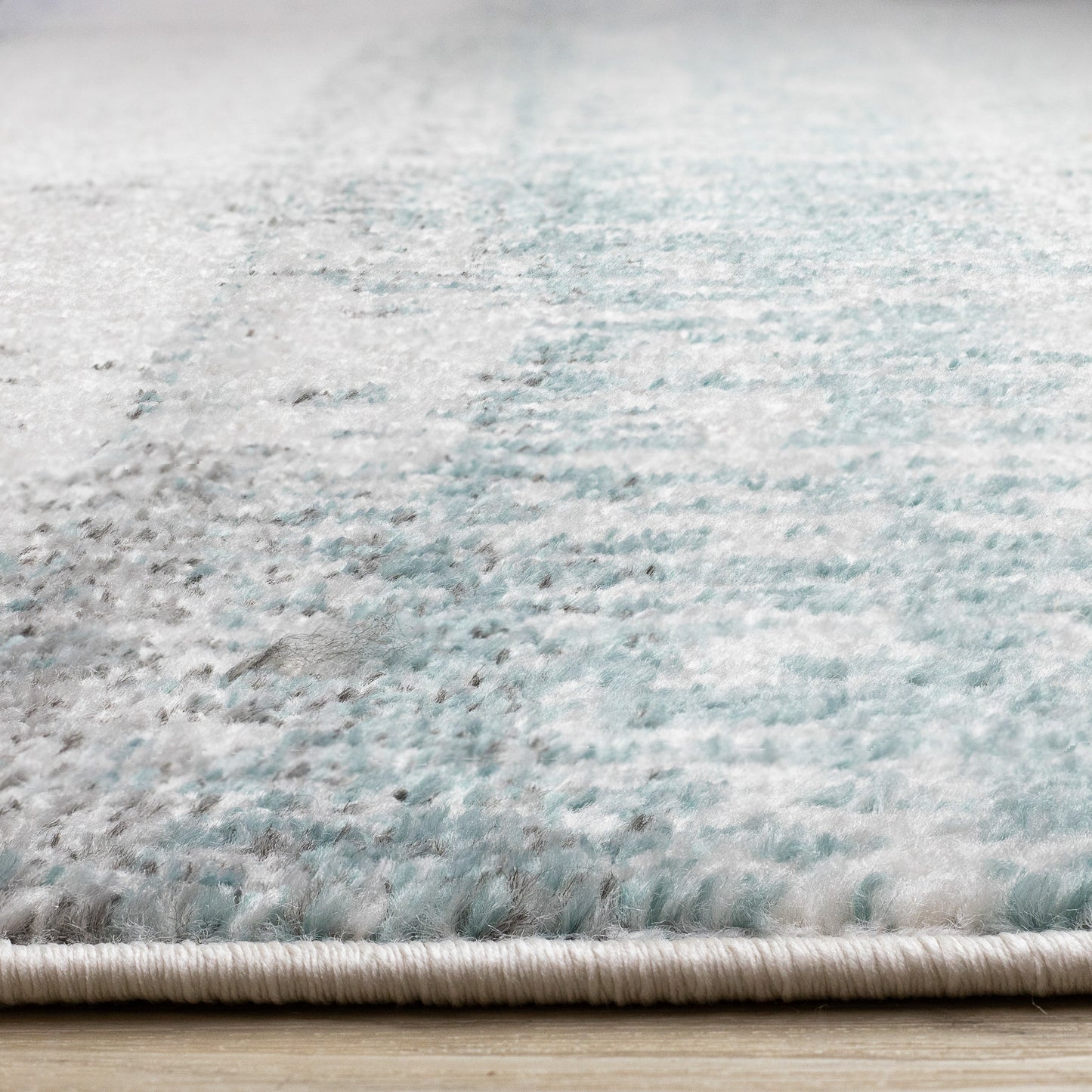 Alfombra contemporánea azul desgastada