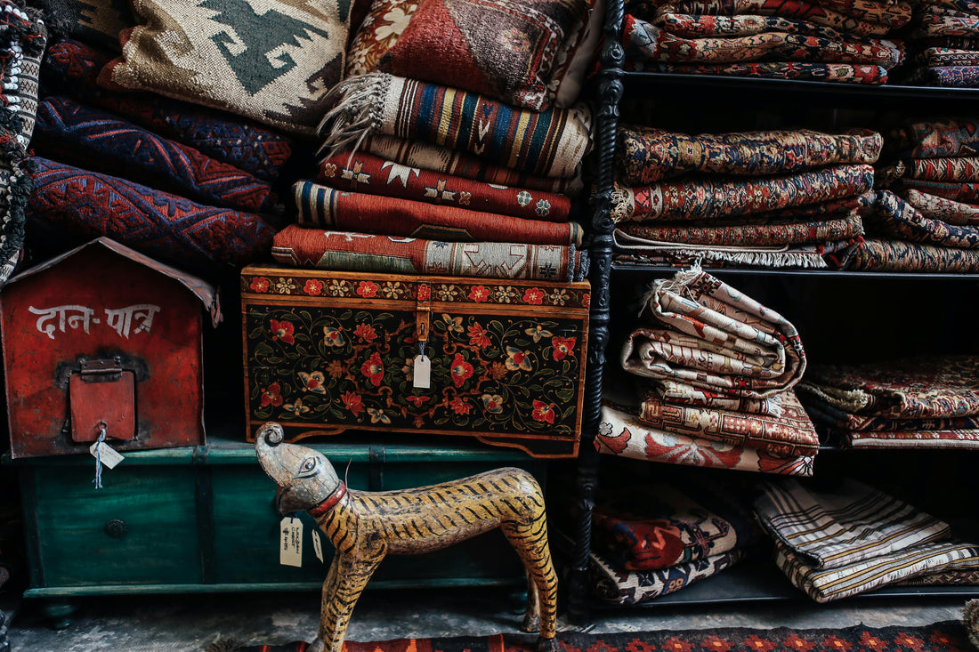 Area rugs are folded in a rack