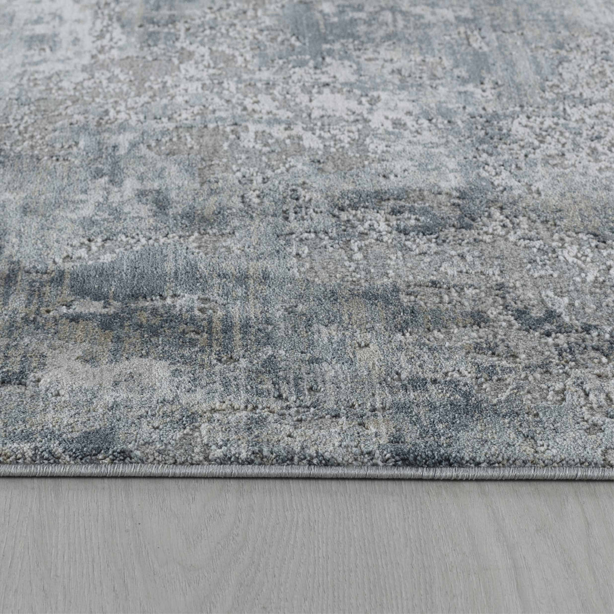 Tapis Eira abstrait contemporain bleu et gris
