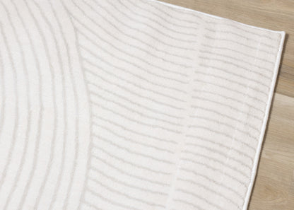 Alfombra geométrica moderna en tonos crema sólidos