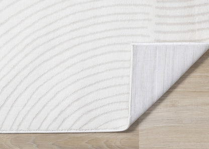 Alfombra geométrica moderna en tonos crema sólidos