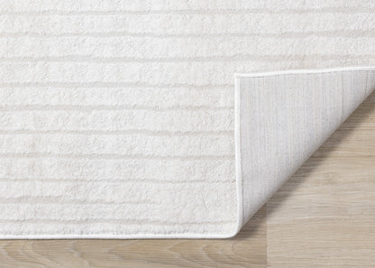 Alfombra moderna de rayas en tonos crema sólidos