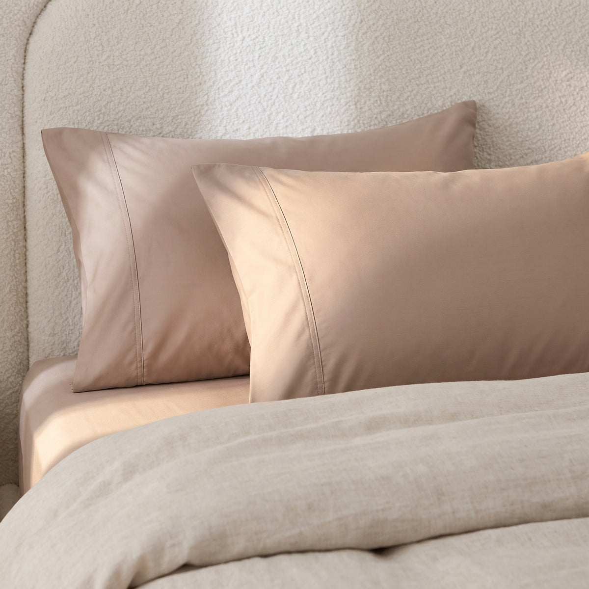 Calla Cotton Brown Pillowcases in a room