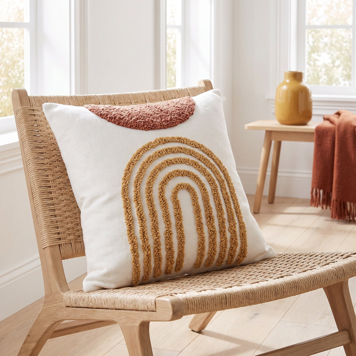 Rhea Tufted Rainbow White Pillow in a room