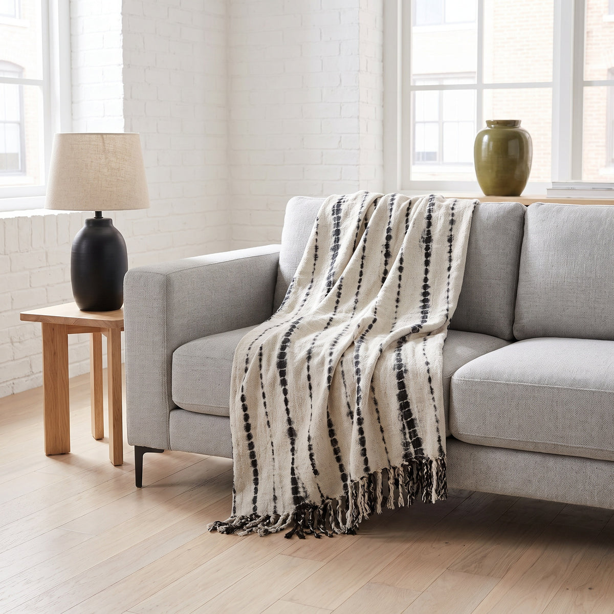 Sova Cotton Black and White Striped Throw in a room