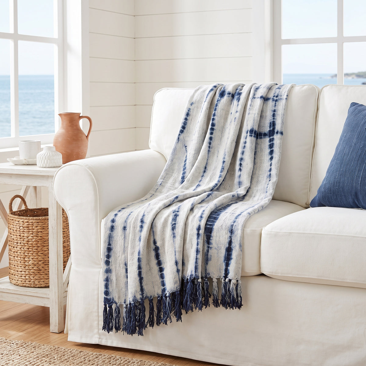 Sova Cotton Blue and White Throw in a room
