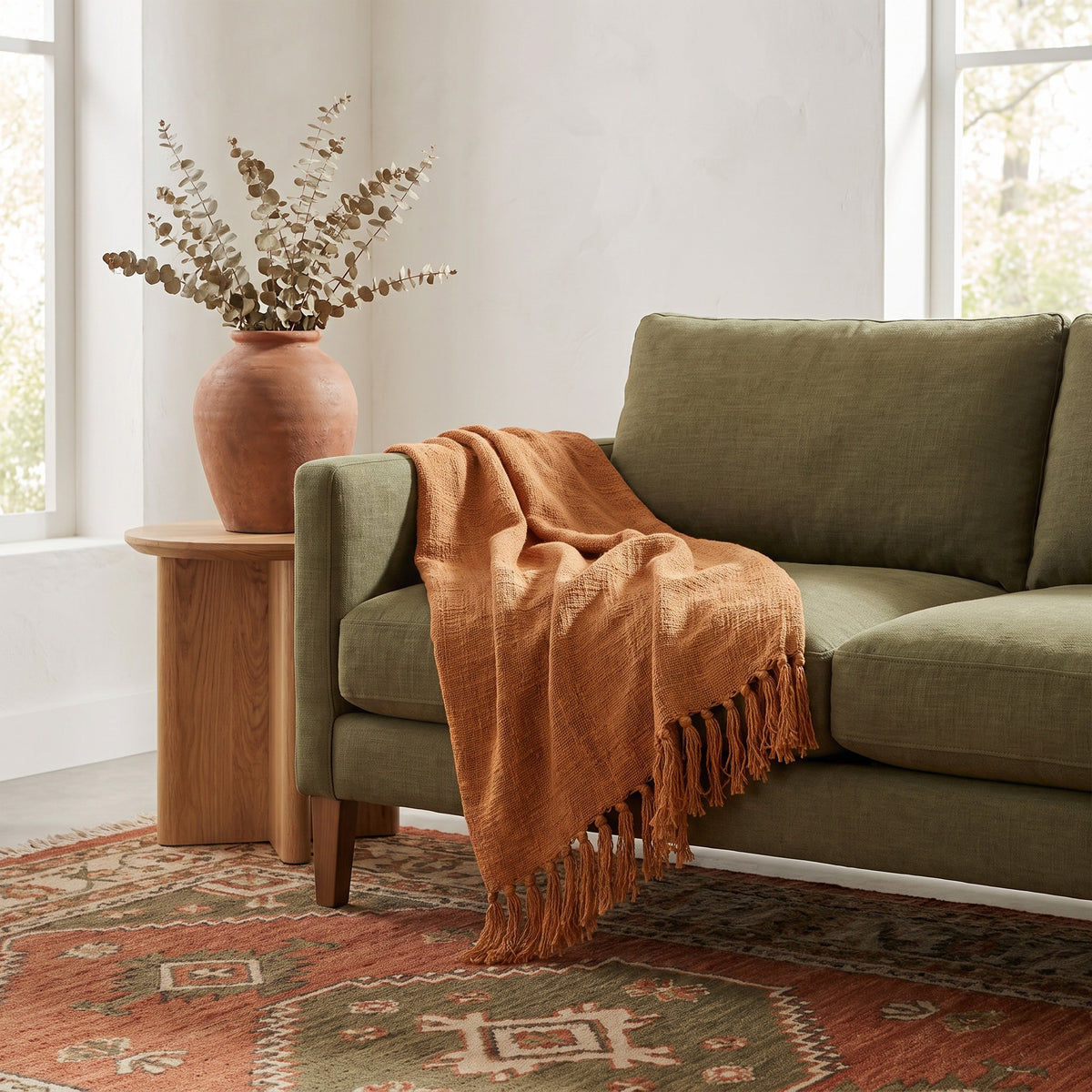 Sova Cotton Terracotta Throw in a room