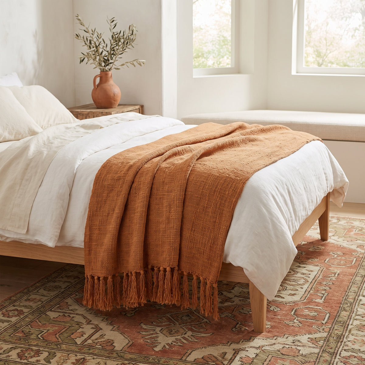 Sova Cotton Terracotta Throw in a room