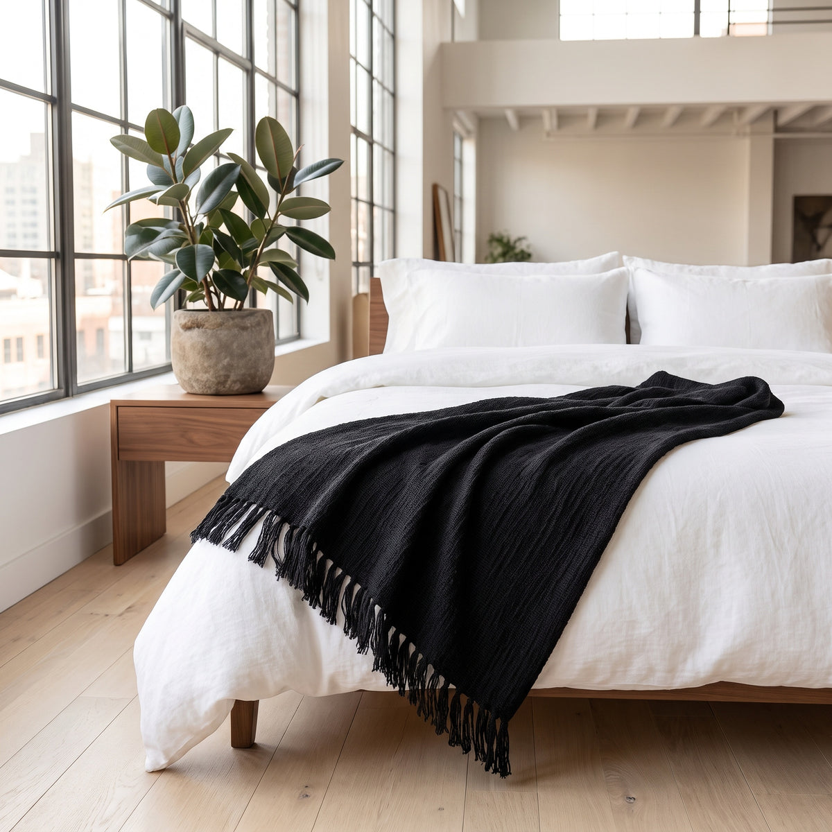 Sova Cotton Deep Black Throw in a room