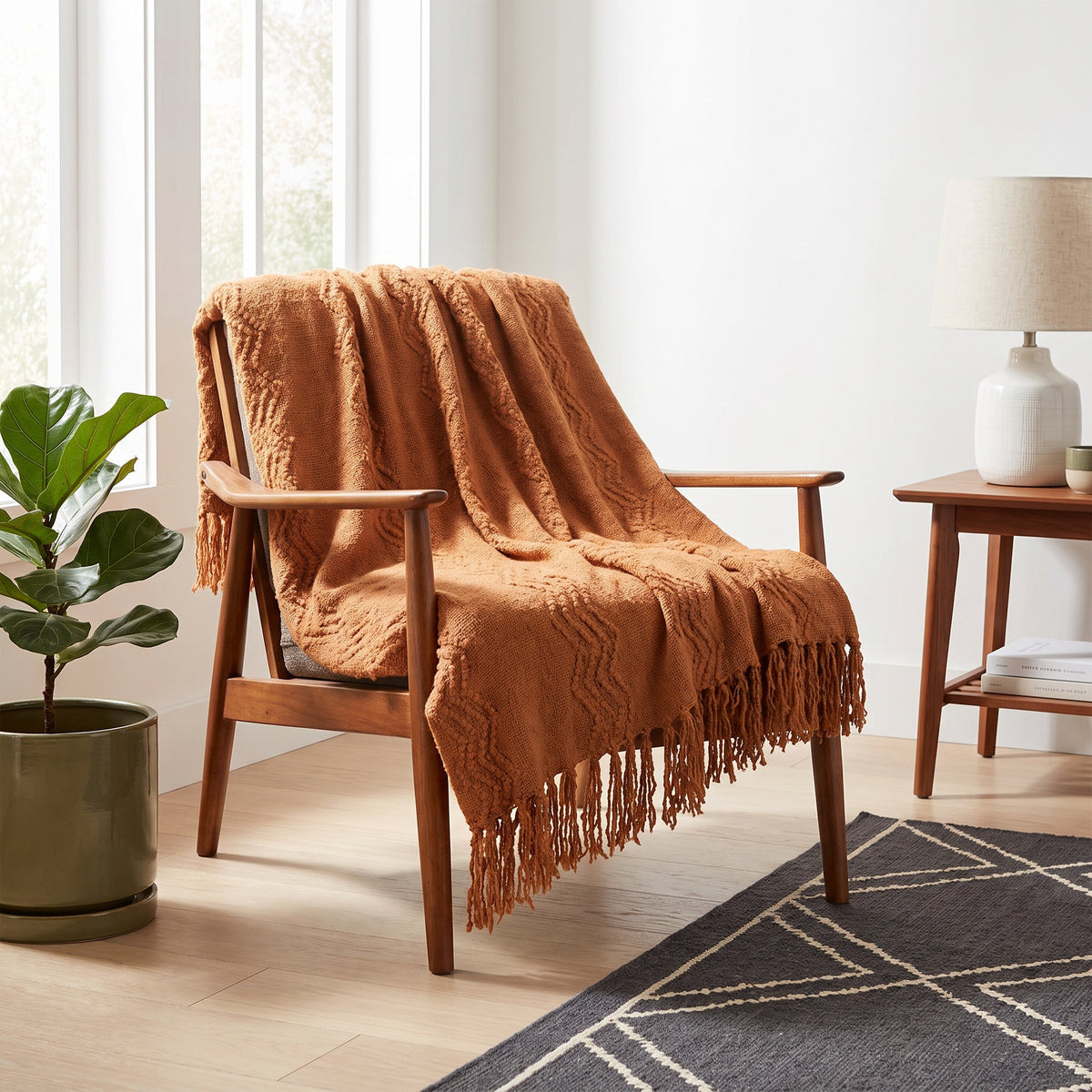 Alden Acrylic Terracotta Throw in a room