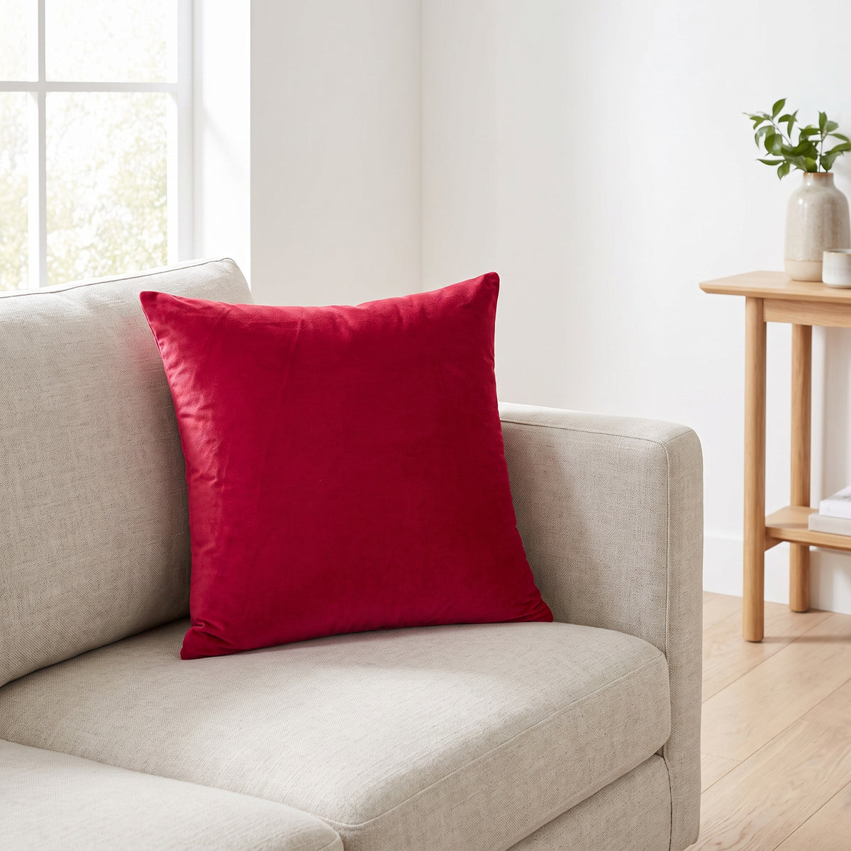 Lumo Velvet Red Pillow in a room