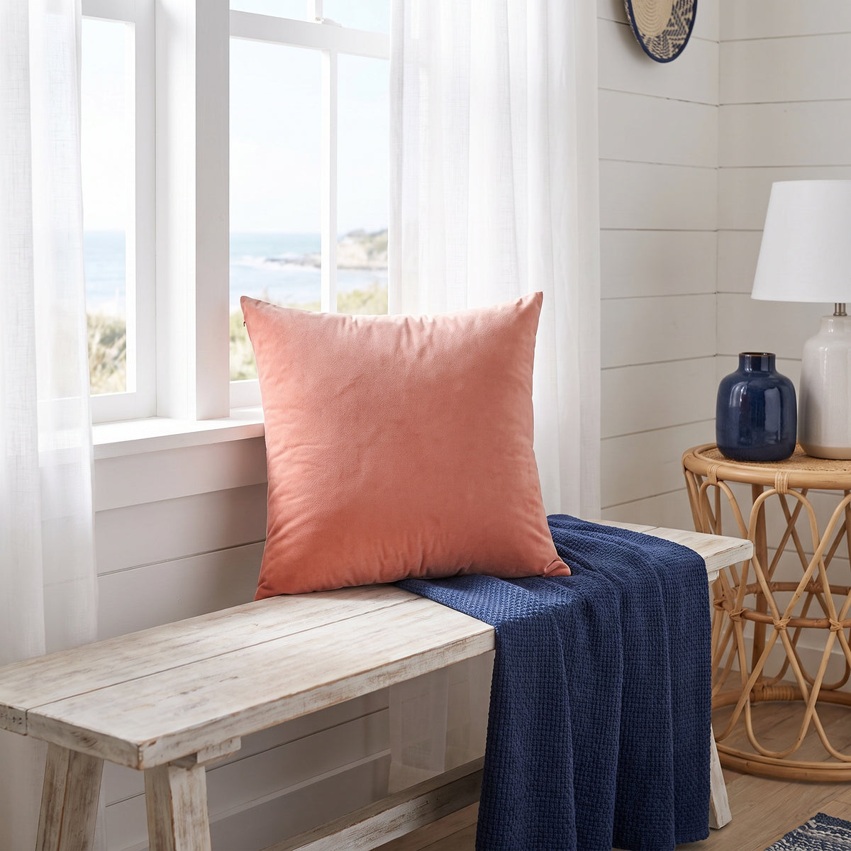 Lumo Velvet Coral Pillow in a room