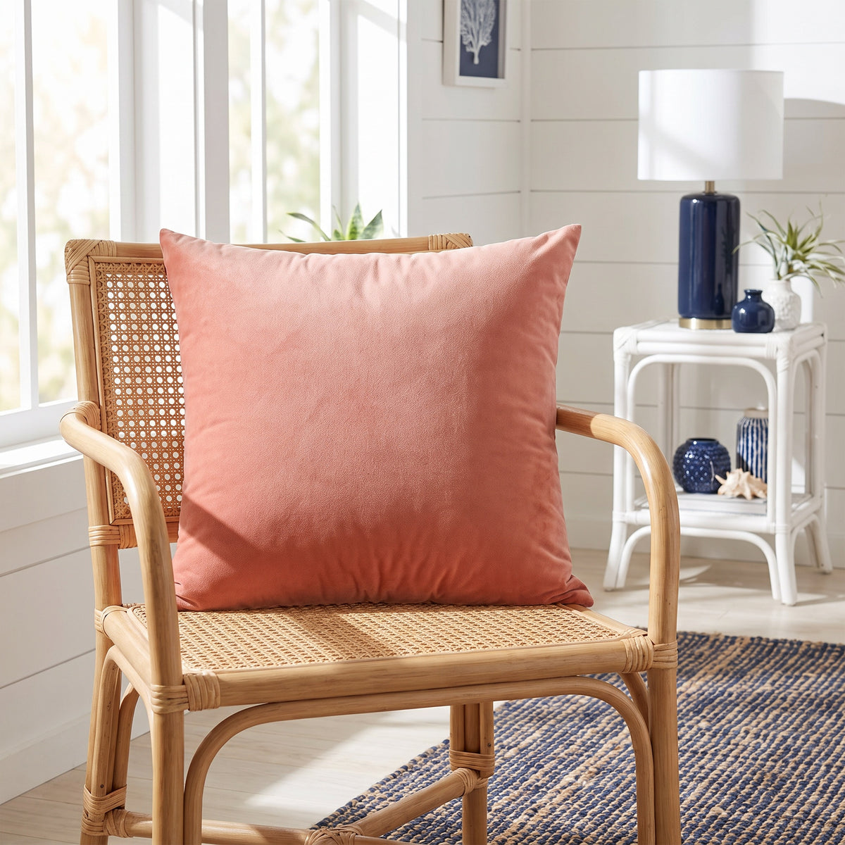 Lumo Velvet Coral Pillow in a room