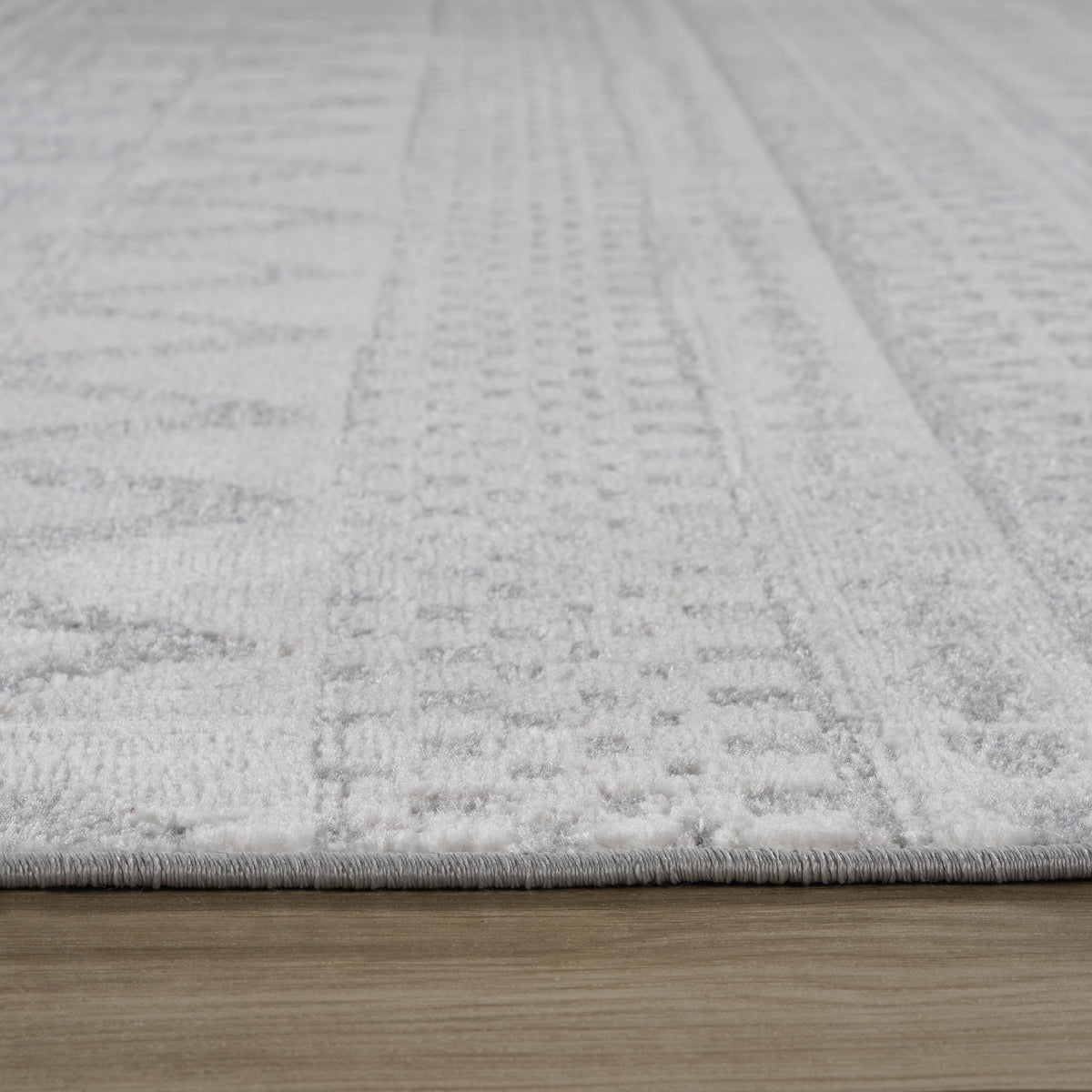 Alfombra Sirocco geométrica contemporánea gris y crema para interiores