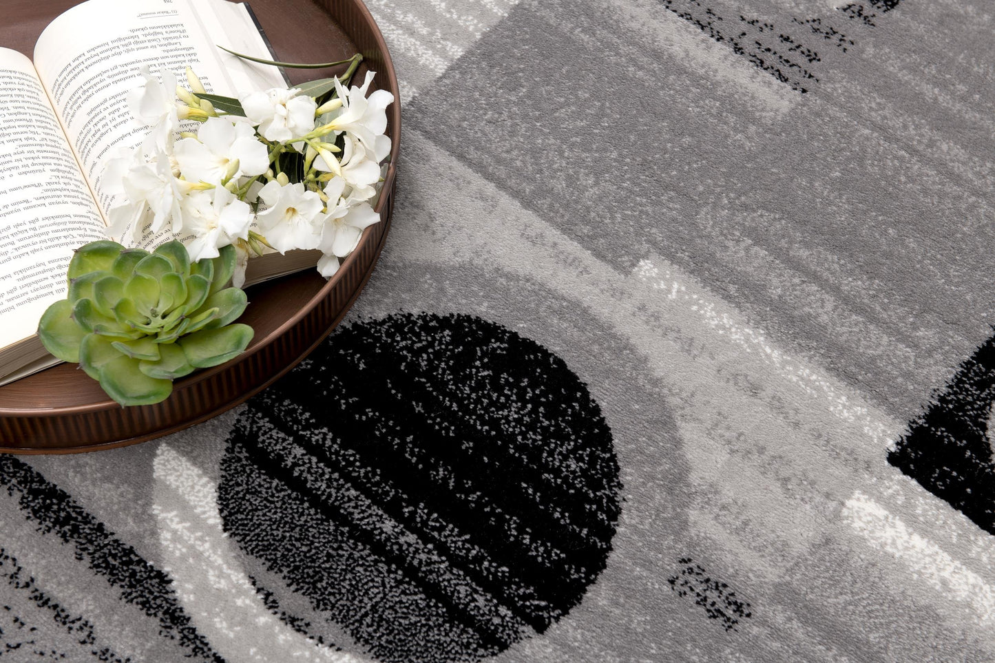 Alfombra negra con cuadros geométricos Montage