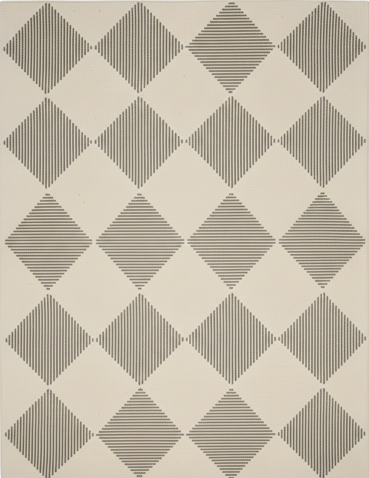 Rug with geometric diamond pattern on a plain background