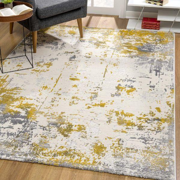 Tapis doré contemporain abstrait Vogue